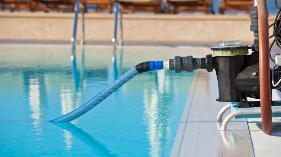 Cleaning pump working with a swimming pool Cleaning pump working with a swimming pool. Horizontal shot